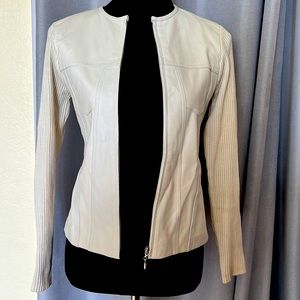 100% leather & 1/2 fabric sweater in color beige.